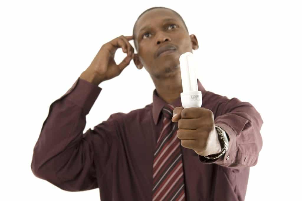 man holding light bulb